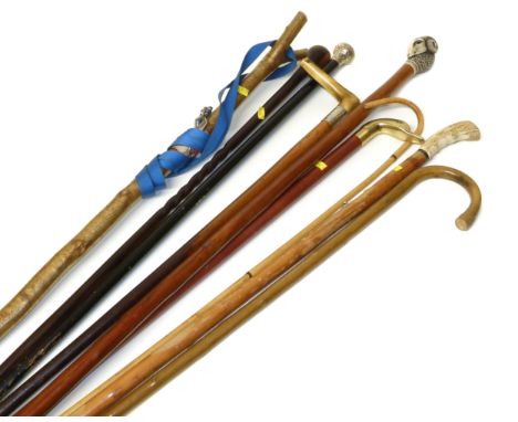Ebonised walking stick with silver top, 19th century rosewood stick and six other sticks. Condition reports are not available