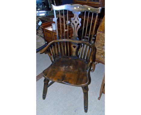 A pair of 20th comb back Windsor chairs Condition reports are not available for Interiors sales.