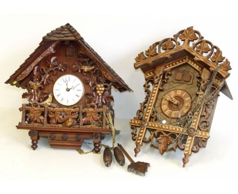 Modern black forest style cuckoo clock and one other clock Condition reports are not available for Interiors sales.