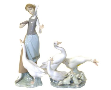 Lladro figure of a girl and a goose and three models of geese Condition reports are not available for Interiors sales.