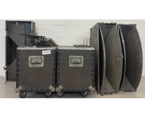 Four flight cases - two on casters, with speaker cones/horns/parts.