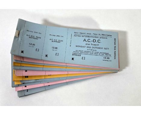A collection of partial ticket books, with approximately 215 complete, untorn and unused tickets for AC/DC at the Manchester 