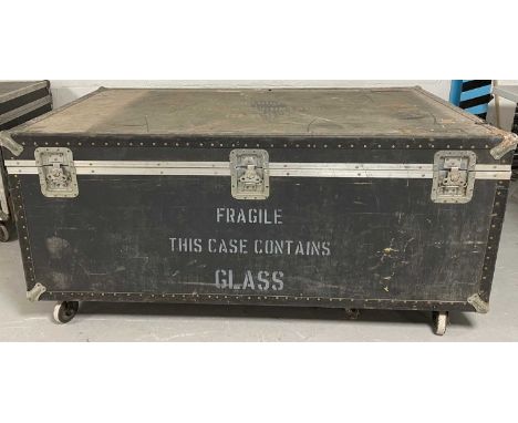 Three flight cases all on casters. One contains a quantity of foam and what appear to be glass tubes possibly used as a light