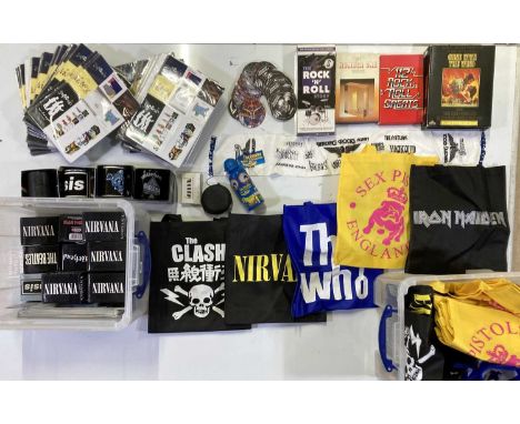 A collection of merchandise and ephemera from bands such as Genesis, Nirvana, Oasis, Iron maiden, Pink Floyd, Sex Pistols, Th