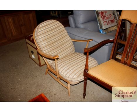 A light Ercol stick back armchair