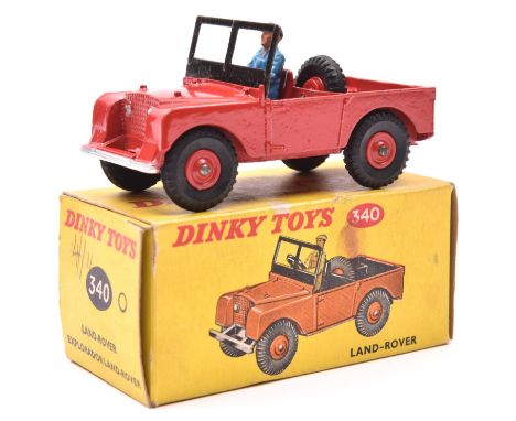 A scarce Dinky Toys Land Rover (340). A late example in red with red plastic wheels and black tyres, complete with plastic dr