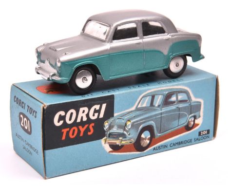 Corgi Toys Austin Cambridge Saloon (201). A very early two tone example in silver and metallic sea green with smooth spun whe