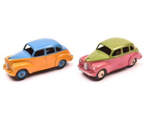 2 scarce Dinky Toys Austin Devon Saloon (152). An example in lime green and cerise with cream wheels and black tyres. Plus an