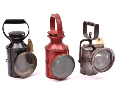 3x railway hand lamps all complete with glasses and burners. 2x Standard three aspect lamps; One painted black and stamped BR