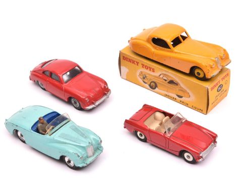 4 Dinky Toys. Jaguar XK120 Coupe (157). An example in deep yellow with lighter yellow wheels, black tyres. Boxed. Plus an Aus