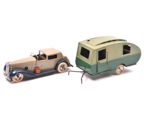 2 Tri-ang Minic tinplate toys. A clockwork Town Coupe No.7m  An example in light grey with dark blue base, early example with