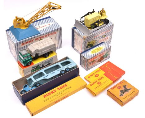 9 Dinky Toys / Supertoys. Lamp Standard (Single Arm) (755). Lamp Standard (Double Arm) (756). Breakdown Lorry  (430), in tan 