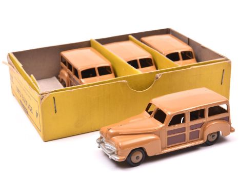 A scarce Dinky Toys Trade Pack of 4 Estate Car 27F. Containing 4 Plymouth Estates all in light brown with dark brown panels, 