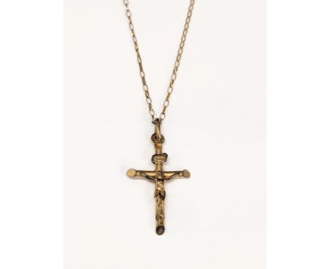 A 9ct gold crucifix pendant on chain. Total weight 1.75g