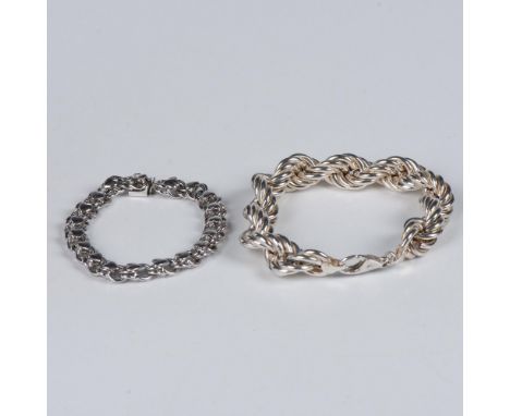 The first bracelet has small hearts and a box tab clasp stamped Sterling. It measures approximately 7.5"L end to end and weig