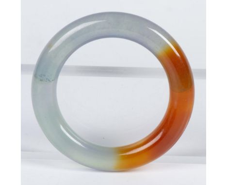 20th century multi-colored jadeite bangle in hues of green, russet, and slight lavender. Dimensions: 3.5" diaCondition: Age r