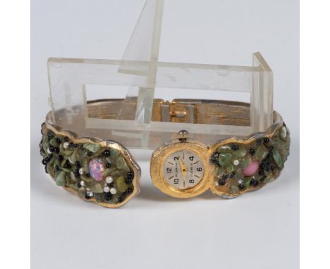 Beautiful jeweled bracelet encrusted in semi-precious green stones, glass opals, pink cabochons, seed pearls and beads. Scall