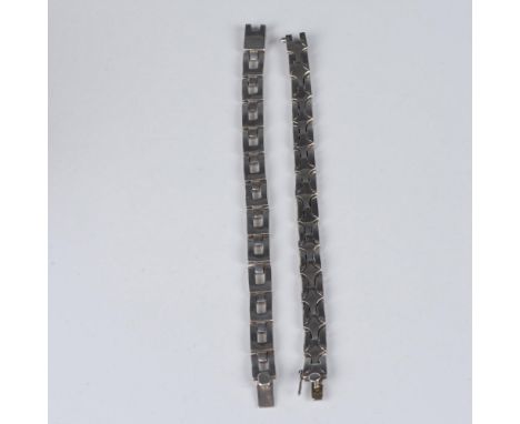 The first bracelet measures 7.5"L and weighs 56g. The second bracelet measures 7.75"L and weighs 40g. Both bracelets have box