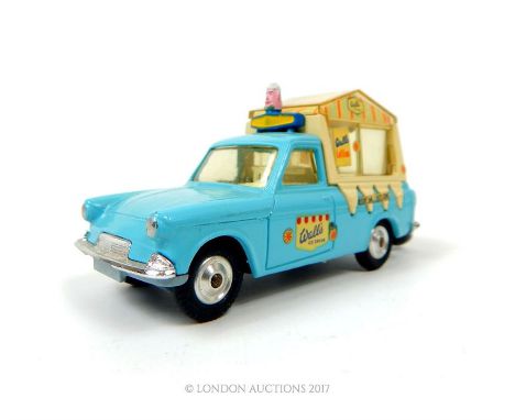 A Corgi toys 474, a blue and white, musical, Wall's Ice Cream van with winder (no longer plays tunes) and sliding windows; wi