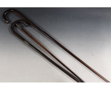 TWO SILVER MOUNTED WALKING STICKS, and a silver topped St. John Ambulance Brigade swagger stick (3)Buyers - for shipping pric