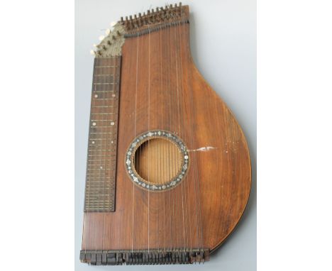 A 19TH CENTURY TABLE ZITHER, with boxwood, mother of pearl and ebony inlay to the centre of the sound board, L 56 cmBuyers - 