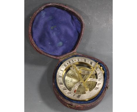 A 19TH CENTURY POCKET SUNDIAL COMPASS, of lacquered brass construction, with silvered chapter ring, in original fitted leathe