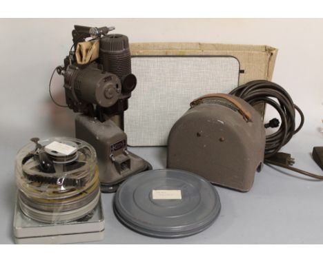 A 'G.B. BELL & HOWELL MODEL 613' PROJECTOR, along with a quantity of accessories and reels of film and an instruction booklet