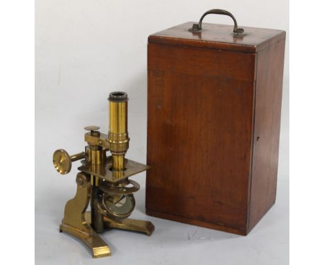 A BRASS MONOCULAR MICROSCOPE, with various lenses, slides and accessories in fitted mahogany case A/FBuyers - for shipping pr