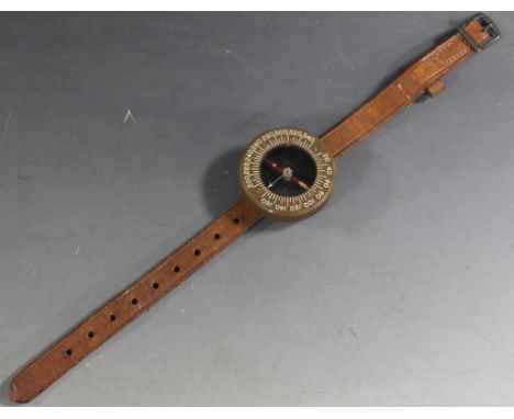 A 'US ARMY CORPS OF ENGINEERS' WRIST COMPASS BY MAGNETO CORP, plastic body on brown leather strap, D 5.5 cmBuyers - for shipp