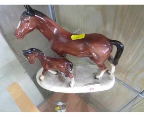 CERAMIC FIGURAL GROUP OF MARE AND FOAL WITH MARK TO BASE.