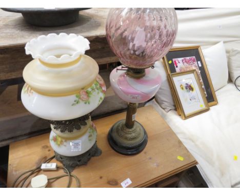 TWO VINTAGE OIL LAMPS CONVERTED INTO ELECTRIC TABLE LAMPS.