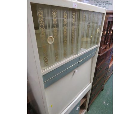A VINTAGE CREAM PAINTED REMPLOY KITCHEN CABINET.