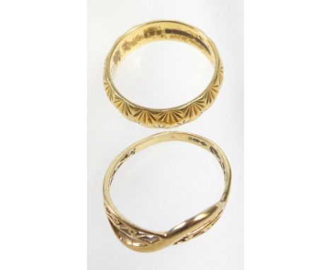 18 CT GOLD RING WITH CARVED DECORATION 6.1 GRAMS AND A 9 CT GOLD CROSSOVER RING WITH PIERCED DECORATION, 1.5 GRAMS (2) 