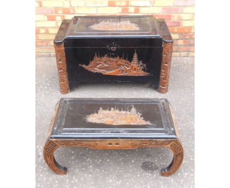 CHINESE EBONISED CAMPHOR LINED CHEST, THE HINGED TOP AND FRONT CARVED WITH FIGURES, BOAT AND BUILDINGS (H. 57.5 CM, W. 101.5 