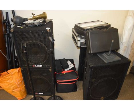 A large quantity of music/performing equipment to include large speakers, microphone stands, microphones, wireless sytems, li