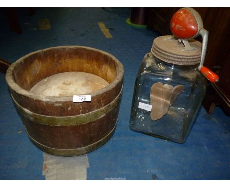 A "Blow" glass butter churn and an Oak cheese press with metal bands.