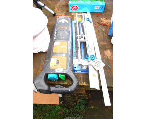 A tile cutter, a straight edge ruler and a detector.
