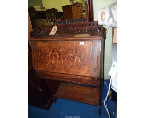 An Oak Student's Bureau having etched floral design to the fall front, frieze drawer and lower shelf, no key, 30" wide x 13" 