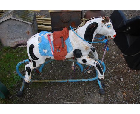 An old tin rocking horse.