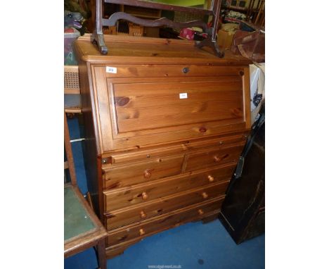 A Pine "Ducal" Bureau with three long and tow short drawers to base, 34'' wide x 17'' deep x 44'' high.