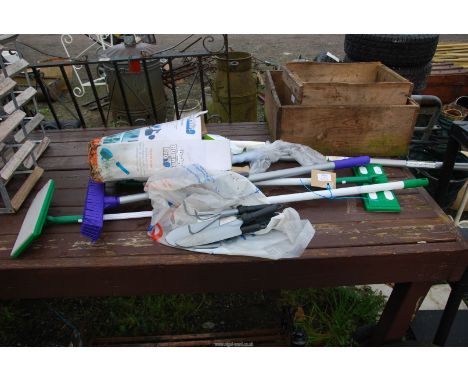Garden tools and window cleaning equipment.