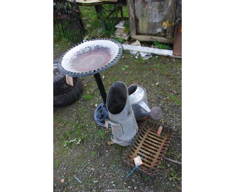 A galvanized watering can, a dog grate, coal scuttle and an aluminium bird bath.