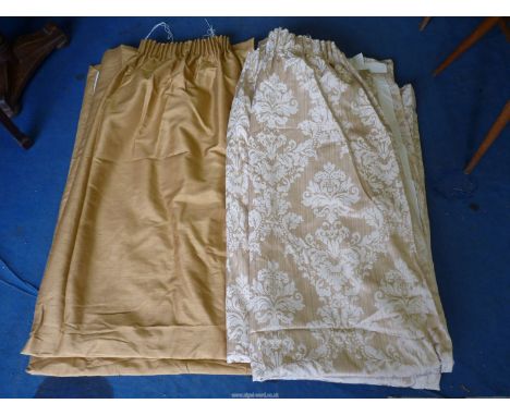 Two pairs of curtains, gold 83" drop x 50" wide and beige floral 80" drop x 74" wide.