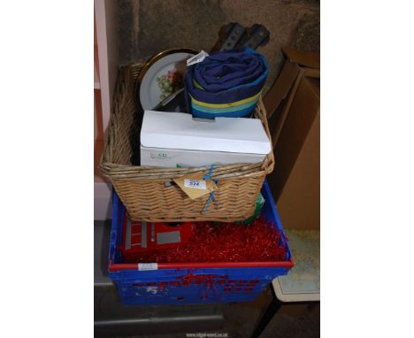 A mini LED projector, picnic basket, torch etc.