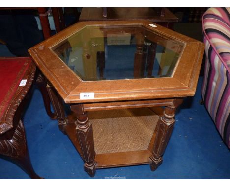 A hexagonal occasional table with lower shelf and glass top, 28" diameter x 24 1/2" x 21" high.