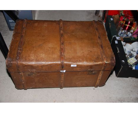 A leather and bentwood bound trunk.