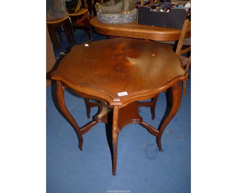 A shaped Mahogany occasional table with lower shelf, 31" diameter x 28" high.