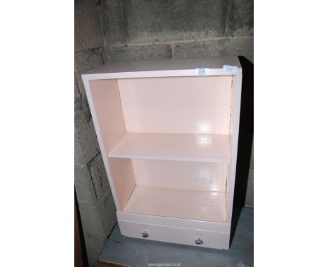 A painted shelf unit.