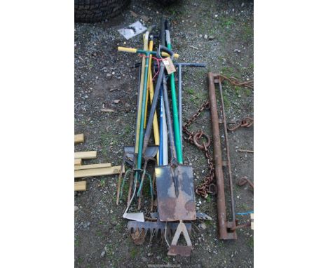 A quantity of garden tools, rakes, hoes, spades, etc.