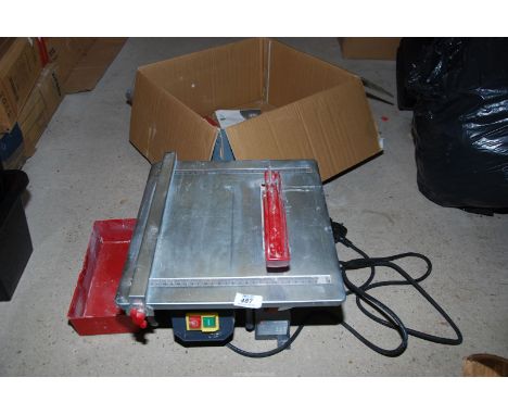 B & Q 240 volt tile cutter, running at time of lotting
